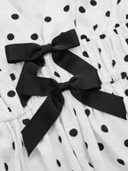 Polka Dot Bow Sleeveless Peplum Top