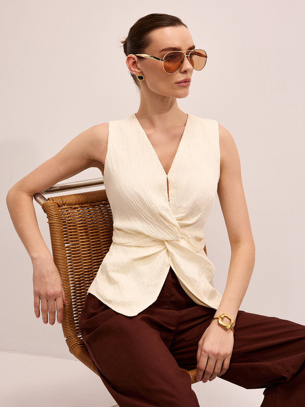 Twisted Sleeveless V-Neck Blouse